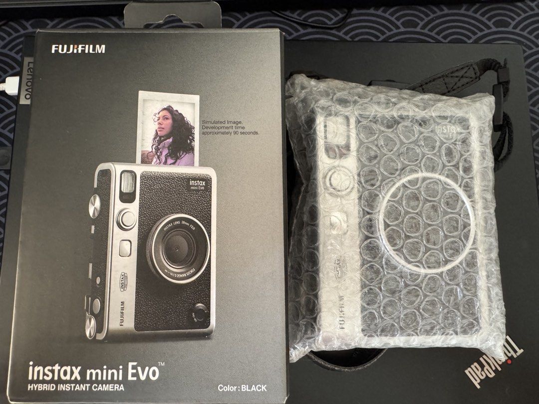 Instax Mini Evo (Category: Cameras) located in Manila. Submitted by preloveditemsxz (Listing ID 1439859639, Image 3). Description: Fujifilm Instax Mini Evo instant camera (black) - Produces instant prints - Bluetooth phone printer function - Can save photos digitally before printing -Rechargeable battery Inclusions: ✅Box ✅Manuals ✅Orig Strap ✅Receipt bought last Oct 2025 ✅Type C Charger ✅2 remaining films ✅32gb microSD RFS: Rarely used / declutte