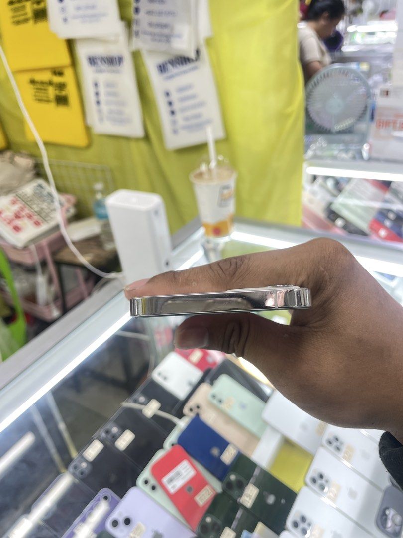 iPhone 12 Pro 256GB 94% BH OPENLINE NO ISSUE (Category: iPhone 12 Series) located in Manila. Submitted by benshop. (Listing ID 1439851494, Image 3). Description: FOR SALE | TRADE/SWAP BenShop Price : 18,500 php ▫️On hand: iPhone 12 Pro ▫️256gb ▫️Openline/Factory unlocked ▫️Silver ▫️94% Batt health ▫️Ntc Local Variant ▫️All Features Working INCLUSIONS & FREEBIES: *CHARGER SET *CLEAR CASE *TEMPERED GLASS MODE OF TRANSACTION: ▫️ STORE PICK UP (Prefe