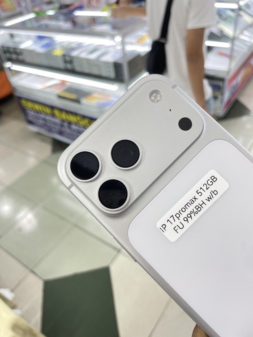 iPhone 17 Pro Max 512GB 100% BH COMPLETE WITH BOX DUAL SIM (Category: iPhone 17 Series) located in Manila. Submitted by benshop. (Listing ID 1439852197, Image 2). Description: FOR SALE | TRADE/SWAP BenShop Price : 86,500 php ▫️On hand: iPhone 17 Pro Max ▫️512gB ▫️Openline/Factory unlocked ▫️Silver ▫️100% Batt health ▫️CH Variant DUAL ▫️Complete Original box ▫️All Features Working INCLUSIONS & FREEBIES: *CHARGER SET *CLEAR CASE *TEMPERED GLASS MOD