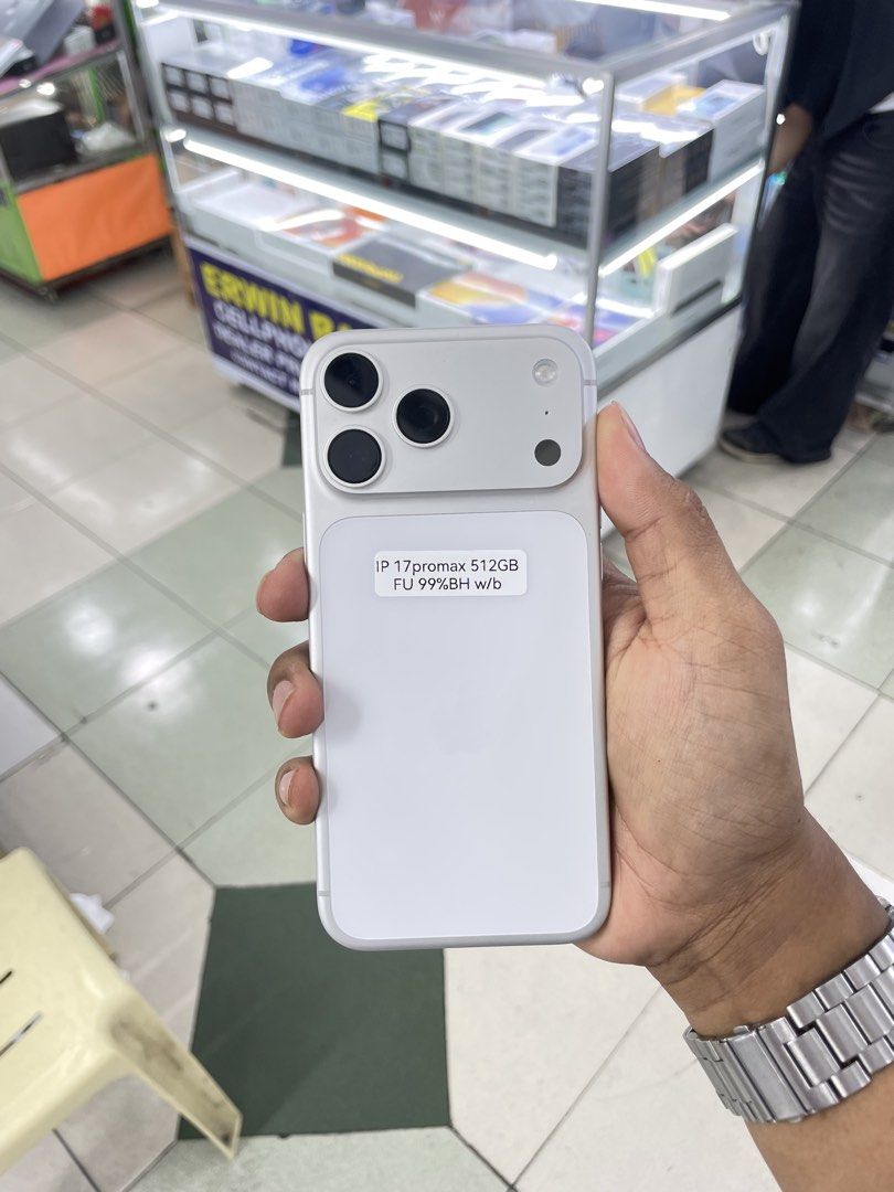 iPhone 17 Pro Max 512GB 100% BH COMPLETE WITH BOX DUAL SIM (Category: iPhone 17 Series) located in Manila. Submitted by benshop. (Listing ID 1439852197, Image 1). Description: FOR SALE | TRADE/SWAP BenShop Price : 86,500 php ▫️On hand: iPhone 17 Pro Max ▫️512gB ▫️Openline/Factory unlocked ▫️Silver ▫️100% Batt health ▫️CH Variant DUAL ▫️Complete Original box ▫️All Features Working INCLUSIONS & FREEBIES: *CHARGER SET *CLEAR CASE *TEMPERED GLASS MOD