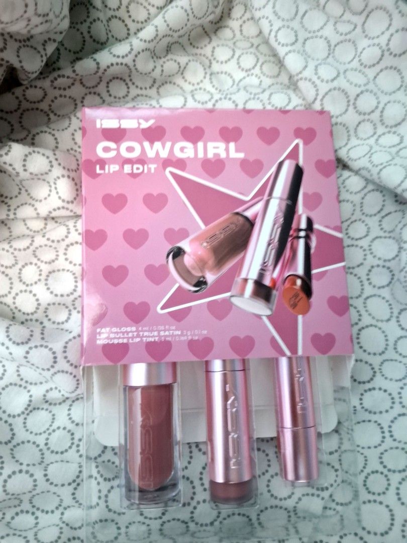 Issy Cowgirl Lip Edit Set (Category: Makeup) located in Quezon City. Submitted by eshacuart (Listing ID 1439927831, Image 1). Description: - Issy Cowgirl Lip Edit Set - Includes 3 lip gloss shades - Beautiful pink packaging - Metallic pink tubes with Issy logo - Ideal for makeup enthusiasts.