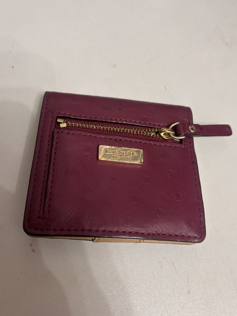 Kate Spade New York Wallet (Category: Wallets & Card holders) located in San Juan City. Submitted by 1013_ajo (Listing ID 1439982625, Image 2). Description: - Authentic Kate Spade New York wallet - Rich burgundy color; Ostrich-embossed exterior - has signs of usage (refer to the attached pictures).