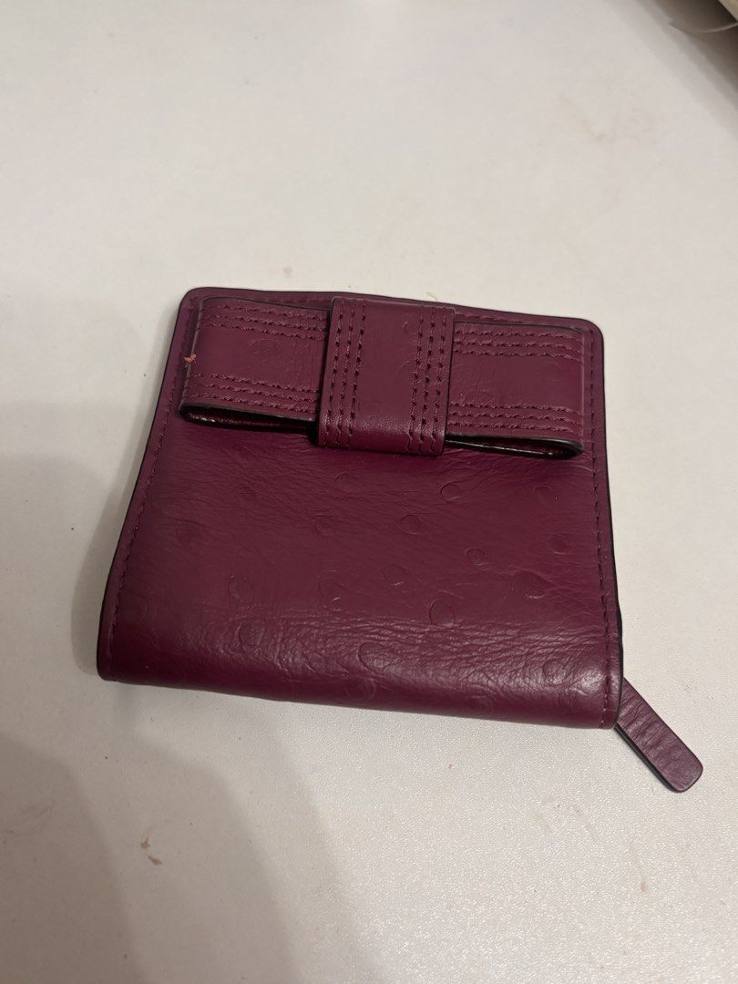 Kate Spade New York Wallet (Category: Wallets & Card holders) located in San Juan City. Submitted by 1013_ajo (Listing ID 1439982625, Image 1). Description: - Authentic Kate Spade New York wallet - Rich burgundy color; Ostrich-embossed exterior - has signs of usage (refer to the attached pictures).