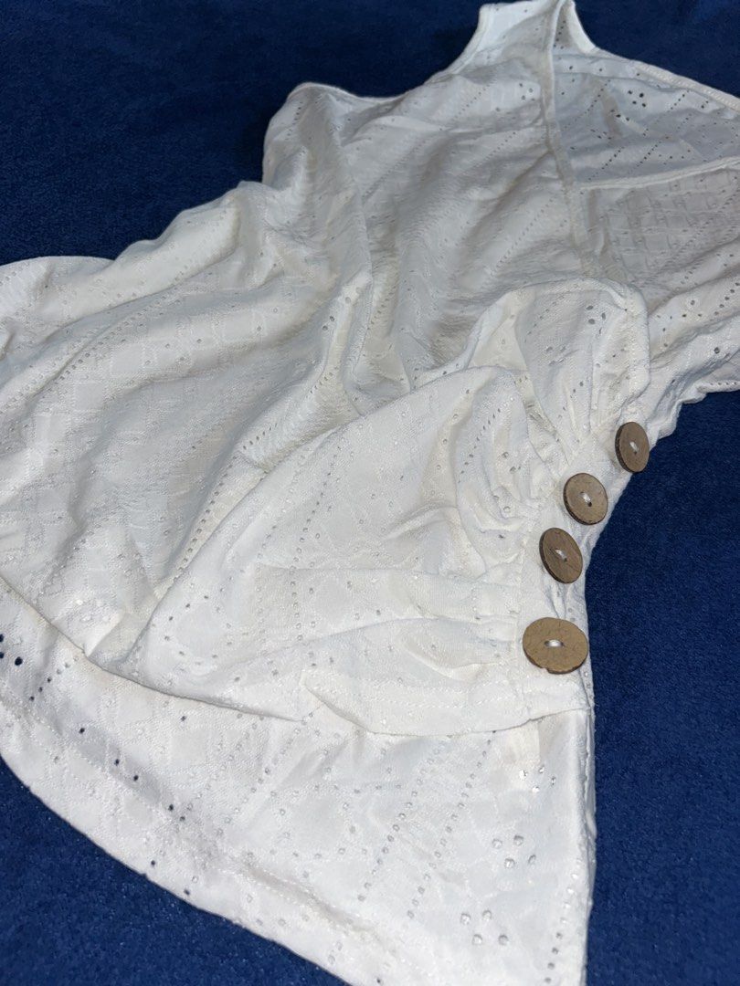 L White Eyelet Lace Faux-Wrap Button Top (Category: Sleeveless) located in Manila. Submitted by declutter_lala (Listing ID 1439952988, Image 2). Description: !!!PLEASE READ!!! White Eyelet Lace Faux-Wrap Button Top ✨Eyelet fabric ✨ V-neckline with faux-wrap drape over the front ✨ Side-gathering detail with wooden buttons L ON TAG ₱140.