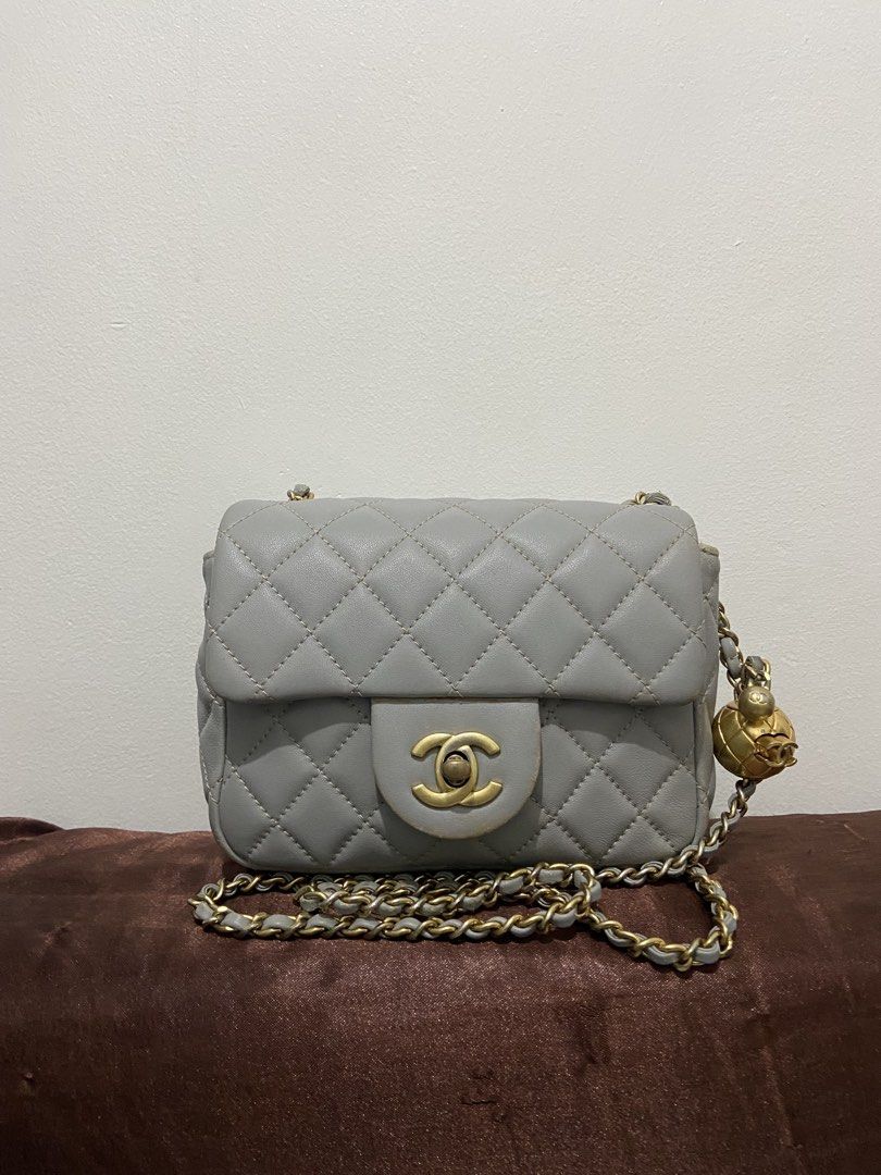 Lambskin Quilted Mini Pearl Crush Flap Light Grey (Category: Luxury Bags & Wallets) located in Manila. Submitted by makeclassy.ph (Listing ID 1439933000, Image 1). Description: Details - Chanel Lambskin Quilted Mini Pearl Crush Flap Light Grey - Grey Color - The included a tag with number 22180814 - Secure Zip closure - Elegant Chain Strap - Adjustable Strap for versatile Wear.