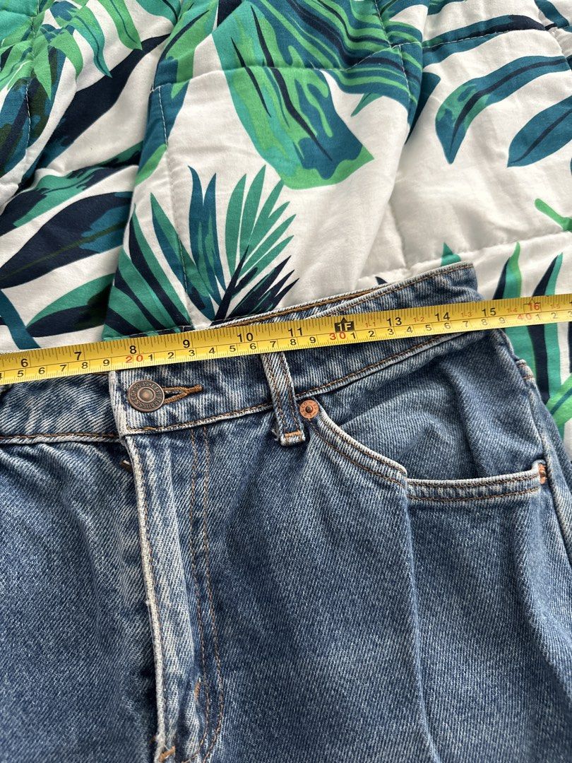 Levi's 563 Jeans (Category: Jeans) located in Quezon City. Submitted by glcsx (Listing ID 1439878752, Image 2). Description: - Levi's 563 Jeans - Classic blue wash - Waist: Approximately 14 inches - Inseam: Approximately 30 inches - Leg opening: Approximately 8 inches - Features the Levi's red tab - Model number: 563 (as indicated on back patch).