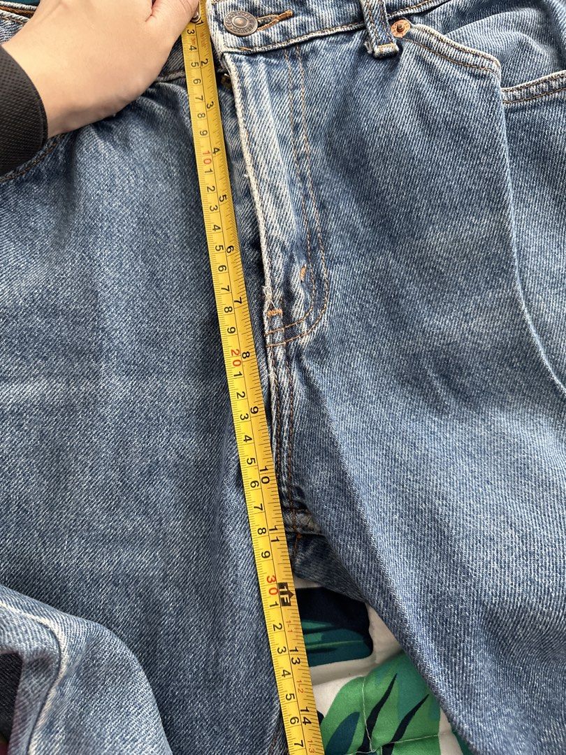 Levi's 563 Jeans (Category: Jeans) located in Quezon City. Submitted by glcsx (Listing ID 1439878752, Image 3). Description: - Levi's 563 Jeans - Classic blue wash - Waist: Approximately 14 inches - Inseam: Approximately 30 inches - Leg opening: Approximately 8 inches - Features the Levi's red tab - Model number: 563 (as indicated on back patch).