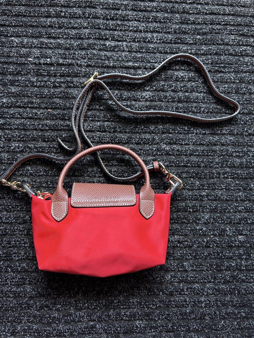 Longchamp Le Pliage Extra Pouch (Category: Luxury Bags & Wallets) located in Pasig City. Submitted by califinestcollectibles (Listing ID 1439850136, Image 2). Description: referred to as the Le Pliage Cuir Extra Pouch or the micro/pouch version with a handle and removable strap Length : 20cm Width : 7 cm Height: 11cm Original/Authentic From USA Actual and Detailed Pictures are Posted Pick Up at One Oasis condominium ortigas extension pasig city O