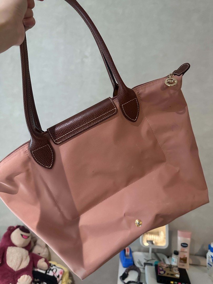 Longchamp Le Pliage Handle Bag (Category: Luxury Bags & Wallets) located in Pasay City. Submitted by airdnasxela (Listing ID 1439990475, Image 3). Description: - Authentic Longchamp Le Pliage tote bag - Lovely pink color - Spacious design, perfect for everyday use, travel, or carry-on - Interior shows some ink marks - original price 7k (bought from poland) .