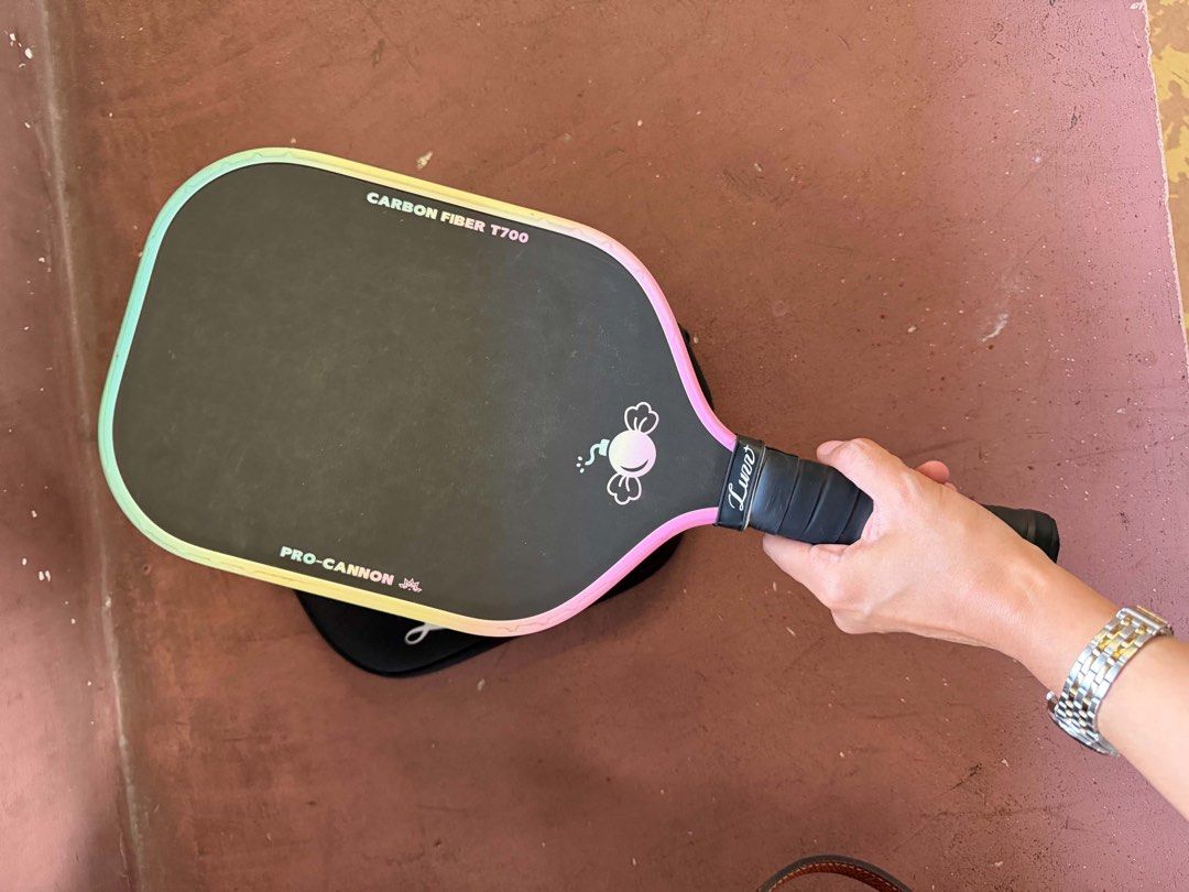 Luuv Pro-Cannon Carbon Fiber T700 Pickleball Paddle (Category: Racket and Ball Sports) located in Manila. Submitted by ajgxx (Listing ID 1439901463, Image 2). Description: - Luuv Pro-Cannon Pickleball Paddle - Premium Carbon Fiber T700 construction for superior performance - Eye-catching rainbow gradient edge design - Unique floral-patterned grip for comfort and style - Comes with a protective black carrying case - Ideal for players seeking both 