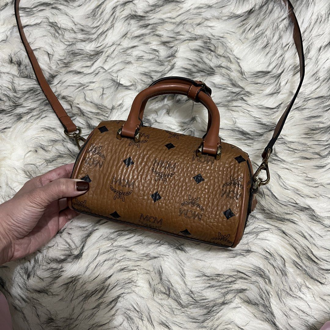 MCM Mini Sling Bag (Category: Luxury Bags & Wallets) located in Davao. Submitted by justin_sells (Listing ID 1439985310, Image 2). Description: MCM Crossbody Bag - preloved, good condi -mini sized sling bag.