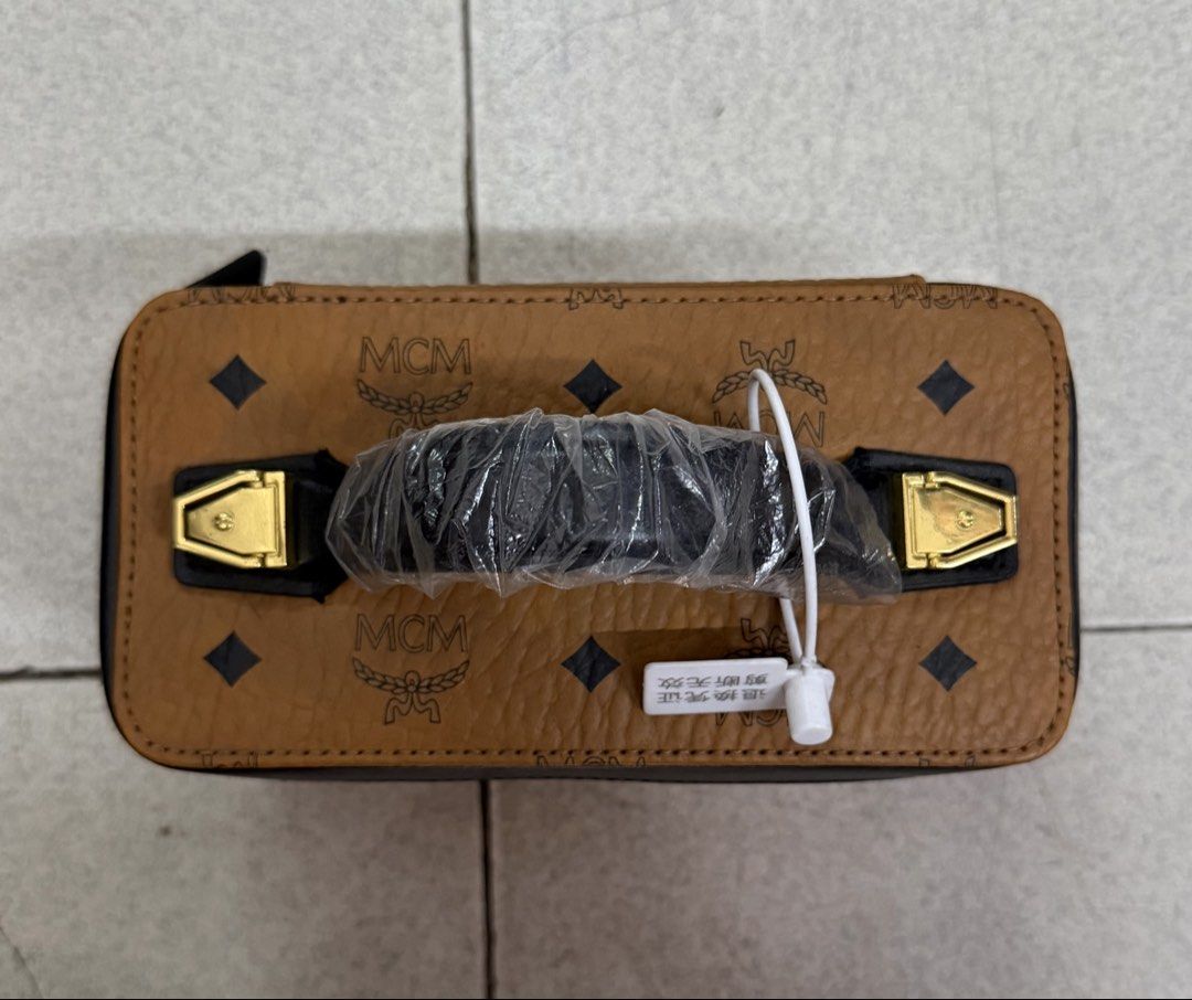 MCM Vanity Case Bag Monogram Brown Leather (Category: Luxury Bags & Wallets) located in Quezon City. Submitted by megchrisanne (Listing ID 1439933863, Image 2). Description: Stylish MCM vanity case in monogram Korea Source With strap First to pay Bdo/Gcash payment LBC/Lalamove Courier .
