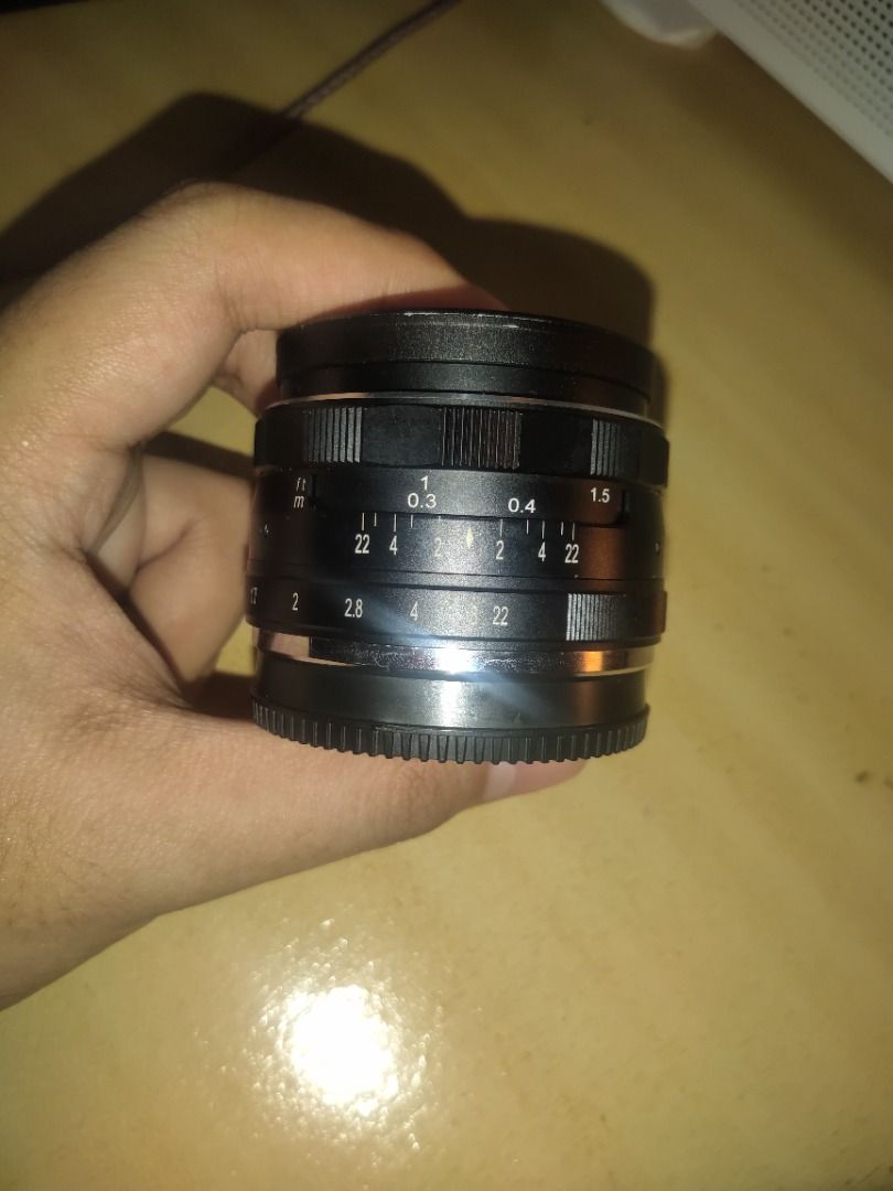 Meike 35mm f/1.7 Lens (Category: Lens & Kits) located in Quezon City. Submitted by micomico7 (Listing ID 1439880261, Image 1). Description: - Meike 35mm f/1.7 lens - 49mm diameter - Aperture range: f/1.7 - f/22 - Minimum focusing distance: 0.3m - Distance markings in meters and feet - Includes lens cap.