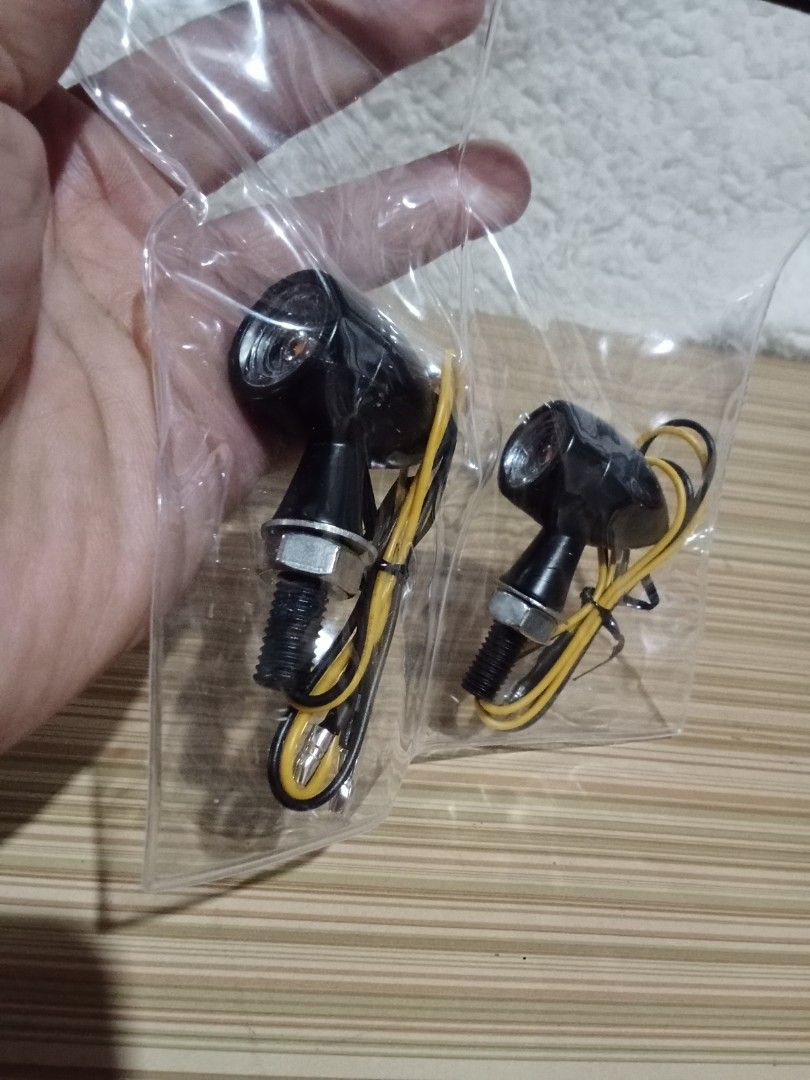 Motorcycle LED Turn Signal Lights - Black (Category: Everything Else Others) located in Bocaue. Submitted by marajapansurplus (Listing ID 1439922112, Image 3). Description: Upgrade your motorcycle with these sleek black LED turn signal lights. Designed for universal fit, these signals provide bright illumination for enhanced visibility and safety on the road. Easy to install with included wiring..