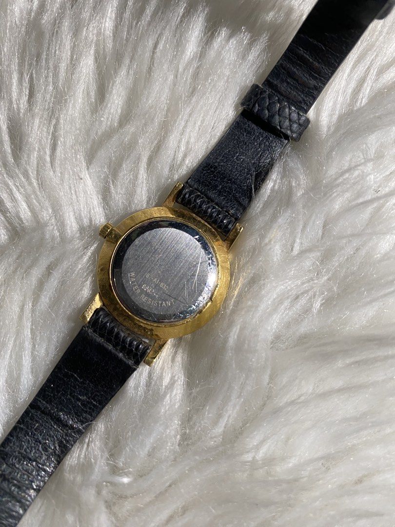 Movado Gold Tone Black Leather Strap Watch (Category: Women's Watches) located in Quezon City. Submitted by nicanicks (Listing ID 1439903619, Image 3). Description: - Elegant Movado watch - Gold-tone case - Original classic black leather strap - Black dial with single dot marker - Secure buckle closure -New battery, just got replaced.