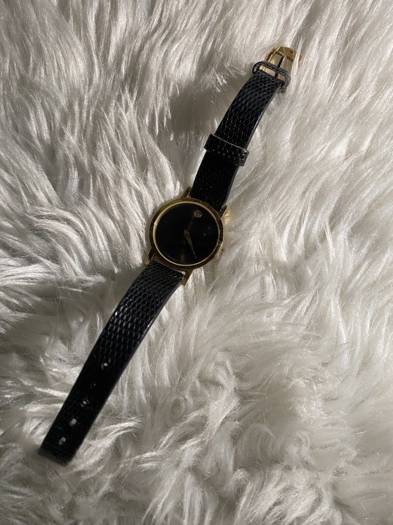 Movado Gold Tone Black Leather Strap Watch (Category: Women's Watches) located in Quezon City. Submitted by nicanicks (Listing ID 1439903619, Image 1). Description: - Elegant Movado watch - Gold-tone case - Original classic black leather strap - Black dial with single dot marker - Secure buckle closure -New battery, just got replaced.