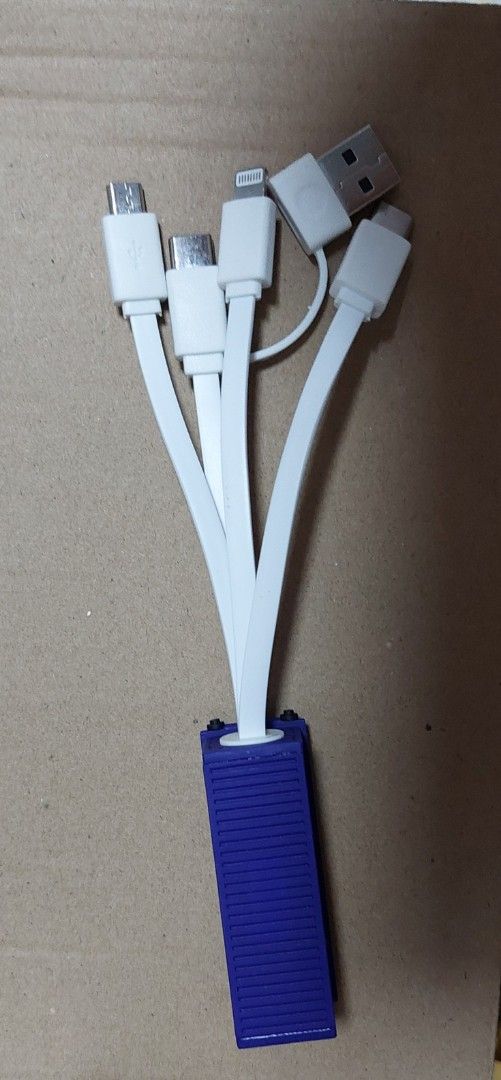 Multi-Port USB Charging Cable (Category: Chargers & Cables) located in Singapore. Submitted by pappy (Listing ID 1439917195, Image 2). Description: - Charge multiple devices simultaneously with one cable. - Features USB-C, Micro USB, and Lightning connectors, etc - Compact and portable. - Convenient for travelling..