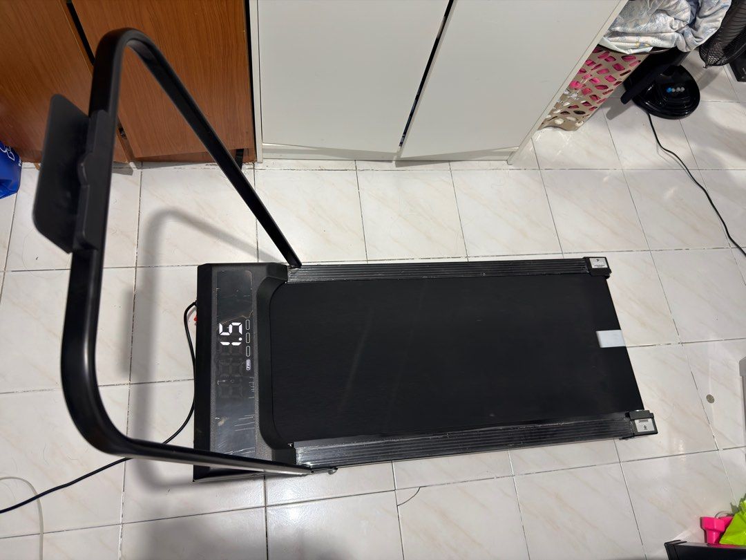 MY-HI portable Treadmill walking pad with Digital Display (Category: Cardio & Fitness Machines) located in Pandi. Submitted by chelleneivy (Listing ID 1439932068, Image 2). Description: Decluttering!! ✅ walking pad - ₱ 3,500 - bought last Feb 2024 pero less than 30 times lang nagamit. - max speed number 10 - naka lagay pa yung plastic film sa screen and sides - with remote - with handle but cannot find the lock na - no box 📍Makati Buyer books th