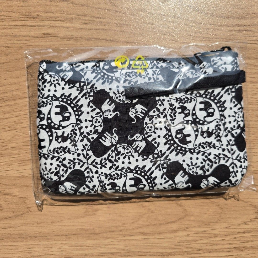 Naraya Elephant Print Pouch (Category: Purses & Pouches) located in Quezon City. Submitted by declutterwithnic (Listing ID 1439864925, Image 2). Description: Naraya pouch with unique elephant print - Brand new, still in original packaging - Features a stylish black zipper - Eye-catching black and white pattern - Small, rectangular design - Ideal for carrying small essentials - Brand tag visible.