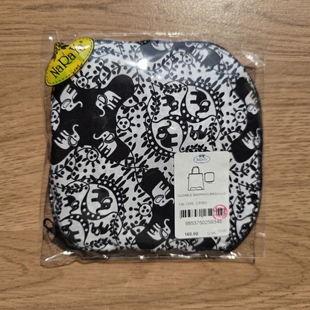 Naraya Foldable Shopping Bag (Category: Tote Bags) located in Quezon City. Submitted by declutterwithnic (Listing ID 1439865243, Image 1). Description: -Naraya foldable shopping bag - Unique black and white elephant pattern - Comes with a compact, zippered pouch - Easy to store and carry - New with original price tag attached.