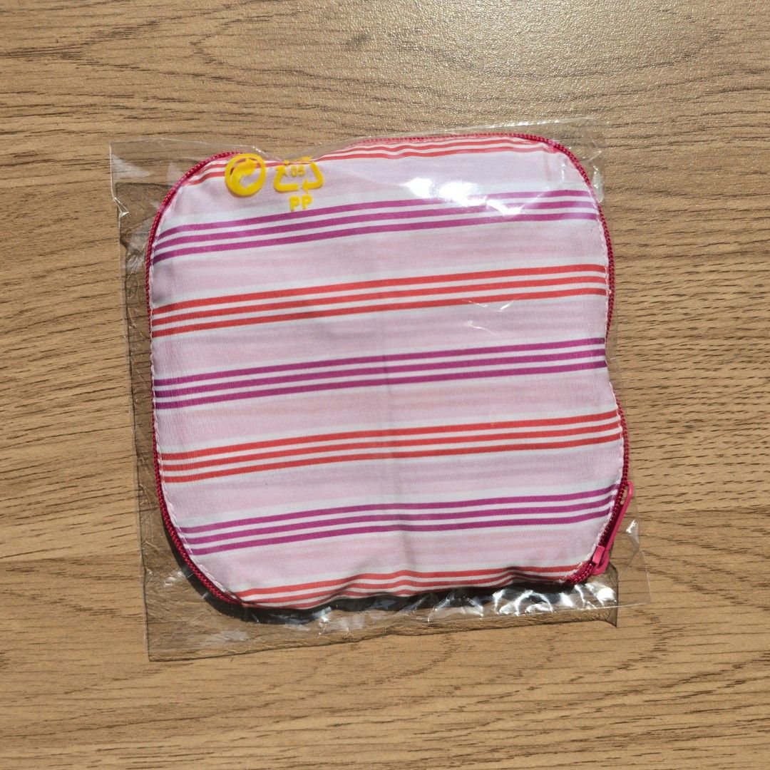 Naraya Foldable Shopping Bag (Category: Tote Bags) located in Quezon City. Submitted by declutterwithnic (Listing ID 1439865482, Image 2). Description: - Brand new Naraya foldable shopping bag. - Pink and red striped design. - Comes in original packaging. - Features a secure zipper closure. - Stylish pink trim. - Folds up for easy carrying..