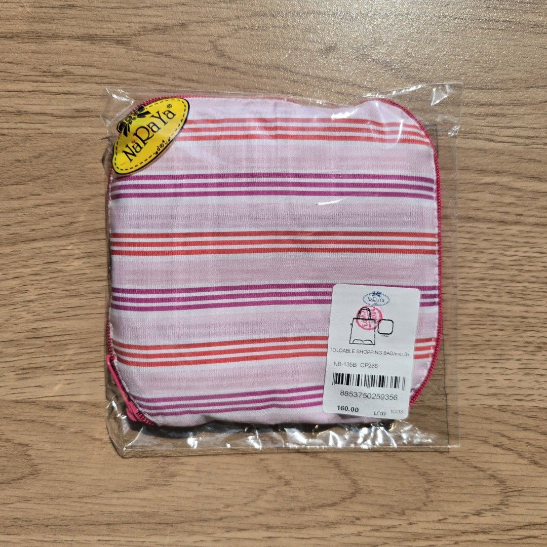 Naraya Foldable Shopping Bag (Category: Tote Bags) located in Quezon City. Submitted by declutterwithnic (Listing ID 1439865482, Image 1). Description: - Brand new Naraya foldable shopping bag. - Pink and red striped design. - Comes in original packaging. - Features a secure zipper closure. - Stylish pink trim. - Folds up for easy carrying..