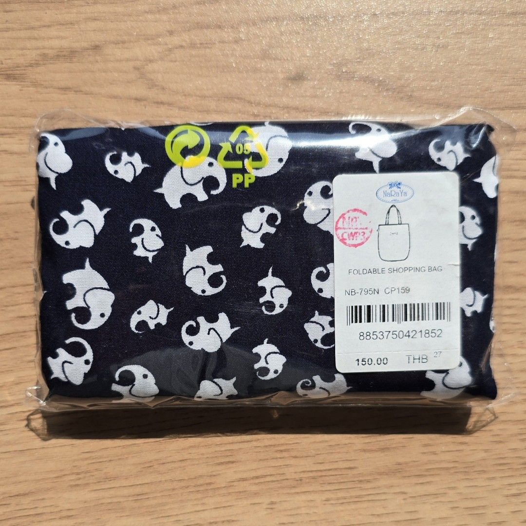 NaRaYa Foldable Shopping Bag (Category: Tote Bags) located in Quezon City. Submitted by declutterwithnic (Listing ID 1439866280, Image 2). Description: - NaRaYa foldable shopping bag - Elephant pattern on navy blue - Compact and convenient for everyday use - Brand new, still in original packaging - Made in Thailand.