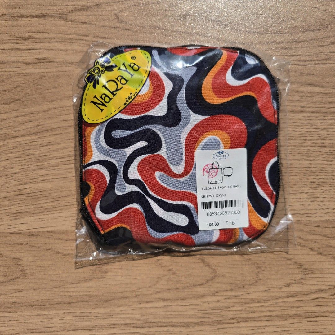 Naraya Shopping bag (Category: Tote Bags) located in Quezon City. Submitted by declutterwithnic (Listing ID 1439865741, Image 1). Description: - Brand new NaRaYa shopping bag. - Eye-catching abstract pattern in red, black, orange, and gray. - Compact, square shape. - Ideal for makeup and small essentials. - Secure zippered closure. - Comes in original packaging..