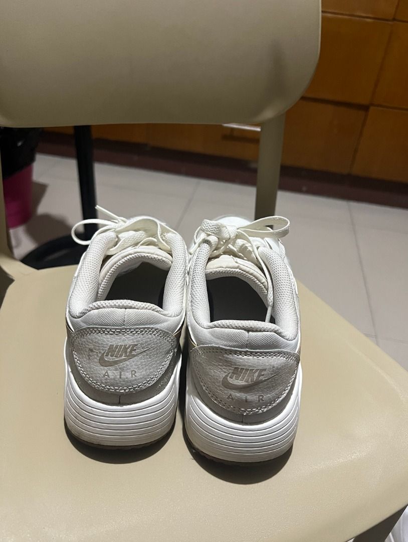 Nike Air Max SC White Sneakers (Category: Sneakers) located in Quezon City. Submitted by carmelaintal (Listing ID 1439863625, Image 2). Description: - Nike Air Max SC - Color: Sail, white upper with light brown swoosh and accents - Size: US 9 - Features white laces and midsole - Outsole: Light brown - Condition: Good.