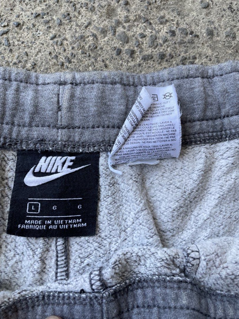 Nike Grey Sweat Shorts Size L (Category: Shorts) located in Siniloan. Submitted by rethr1ft (Listing ID 1439909983, Image 3). Description: - 34 waist - Comfortable grey Nike sweat shorts - Elastic waistband with drawstring - Features a back pocket - Made in Vietnam - Ideal for casual wear or athletic activities.