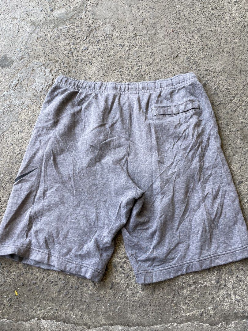 Nike Grey Sweat Shorts Size L (Category: Shorts) located in Siniloan. Submitted by rethr1ft (Listing ID 1439909983, Image 2). Description: - 34 waist - Comfortable grey Nike sweat shorts - Elastic waistband with drawstring - Features a back pocket - Made in Vietnam - Ideal for casual wear or athletic activities.