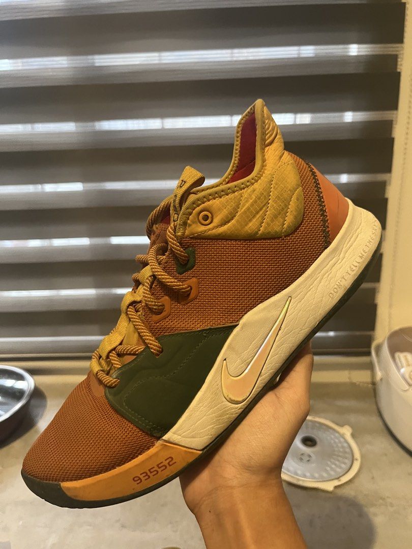 Nike PG 3 Paul George "ALL STAR” ACG (Category: Sneakers) located in Rodriguez. Submitted by mmmm552 (Listing ID 1439989384, Image 2). Description: - Authentic Nike PG 3 basketball shoes - Unique colorway: brown, green, and yellow accents - Distinctive honeycomb pattern outsole for superior grip - Designed for performance and style - Ideal for basketball enthusiasts MINOR ISSUES SHOWN IN PHOTO -Need Wash RFS: Size too big PM ME NEGOTIABLE :D.