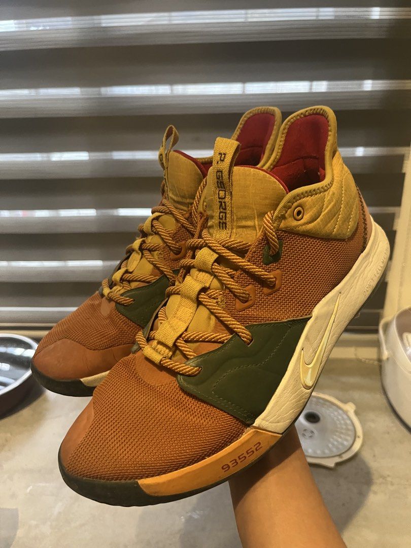 Nike PG 3 Paul George "ALL STAR” ACG (Category: Sneakers) located in Rodriguez. Submitted by mmmm552 (Listing ID 1439989384, Image 1). Description: - Authentic Nike PG 3 basketball shoes - Unique colorway: brown, green, and yellow accents - Distinctive honeycomb pattern outsole for superior grip - Designed for performance and style - Ideal for basketball enthusiasts MINOR ISSUES SHOWN IN PHOTO -Need Wash RFS: Size too big PM ME NEGOTIABLE :D.