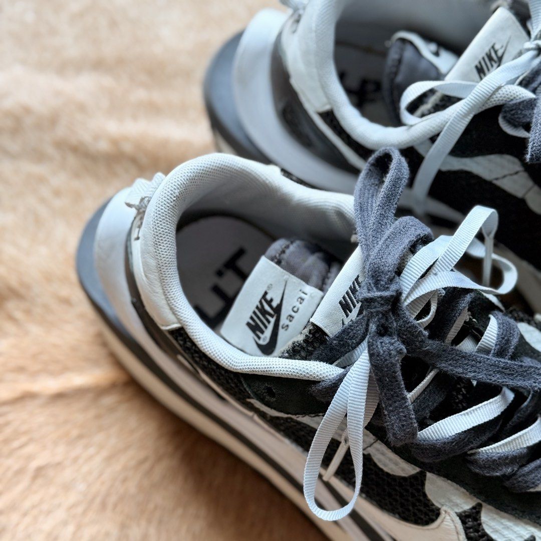Nike Sacai VaporWaffle (Category: Sneakers) located in Taguig. Submitted by apartment.twentyseven (Listing ID 1439967662, Image 3). Description: Nike Sacai Vapor Waffle Black/White Size: 9.5 US Condition: Used with minor tear (check photos for details) No box, pair only. Price: ₱7,000.