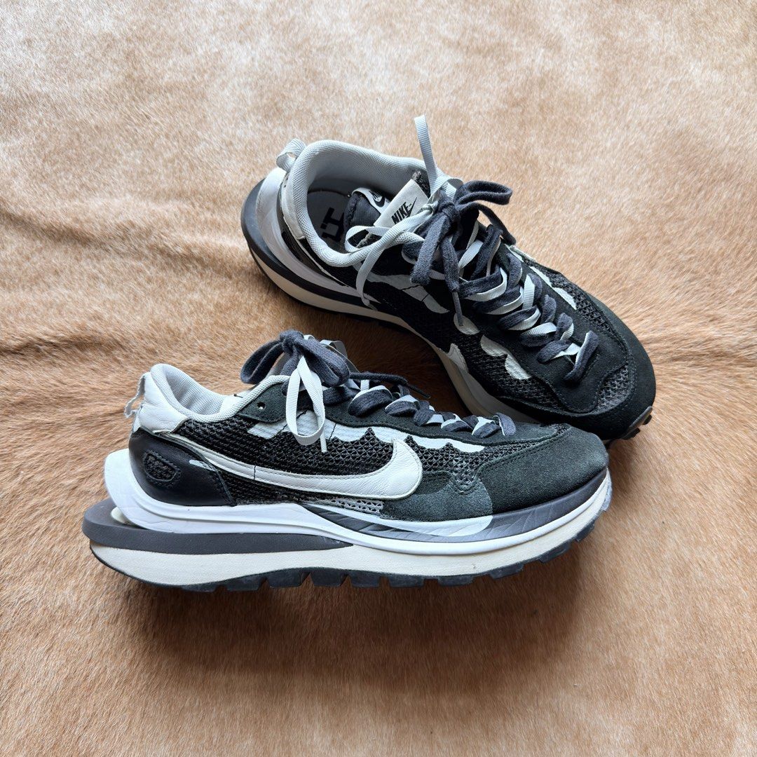 Nike Sacai VaporWaffle (Category: Sneakers) located in Taguig. Submitted by apartment.twentyseven (Listing ID 1439967662, Image 1). Description: Nike Sacai Vapor Waffle Black/White Size: 9.5 US Condition: Used with minor tear (check photos for details) No box, pair only. Price: ₱7,000.