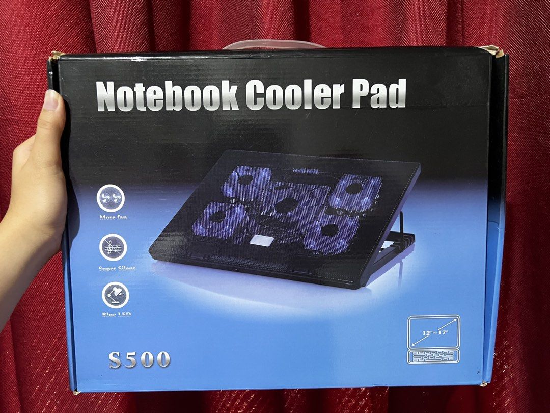 Laptop cooler elevated stand for laptop Notebook Cooler Pad S500 (Category: Other Accessories) located in Taguig. Submitted by doyoungkskdkxndj (Listing ID 1439840728, Image 1). Description: - Multiple fans for efficient cooling - Blue LED lights - Adjustable elevation for comfortable viewing - Compatible with 12-17 inch laptops - Non-slip pad design for secure use - Product specifications include size, fan size, speed, air volume, and power (det