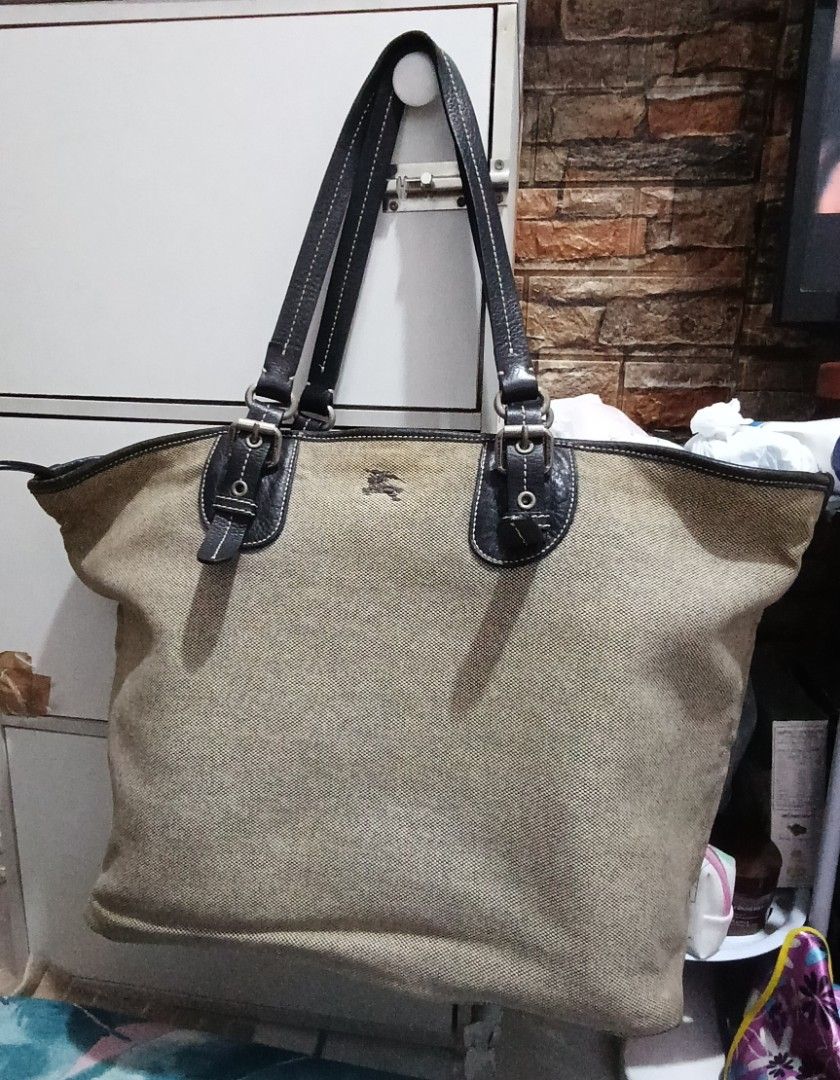 OG Burberry Blue Label Tote Bag (Category: Luxury Bags & Wallets) located in Manila. Submitted by trendyie100 (Listing ID 1439930245, Image 1). Description: Selling as is where is, OG Burberry Blue Label Tote Bag, Horse Logo, Canvas. Big capacity, with signs of usage and minimal flaws, nastock kasi sa di paggamit, still good in actual, napakatibay, just need cleaning/bag spa lang to look fresh and new again, if di maarte ready na for use, as is k