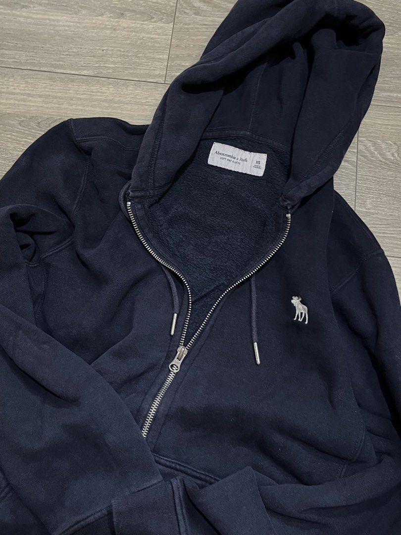 Original Abercrombie Navy Blue Soft Fleece Jacket (Category: Coats, Jackets and Outerwear) located in Mandaluyong City. Submitted by namislounge (Listing ID 1439905481, Image 1). Description: Like new | bought in the US for $49 - Classic navy blue Abercrombie & Fitch zip-up hoodie - Full zip closure - Very warm material - Two front pockets - Signature embroidered Abercrombie & Fitch moose logo on chest - Perfect for everyday casual style.