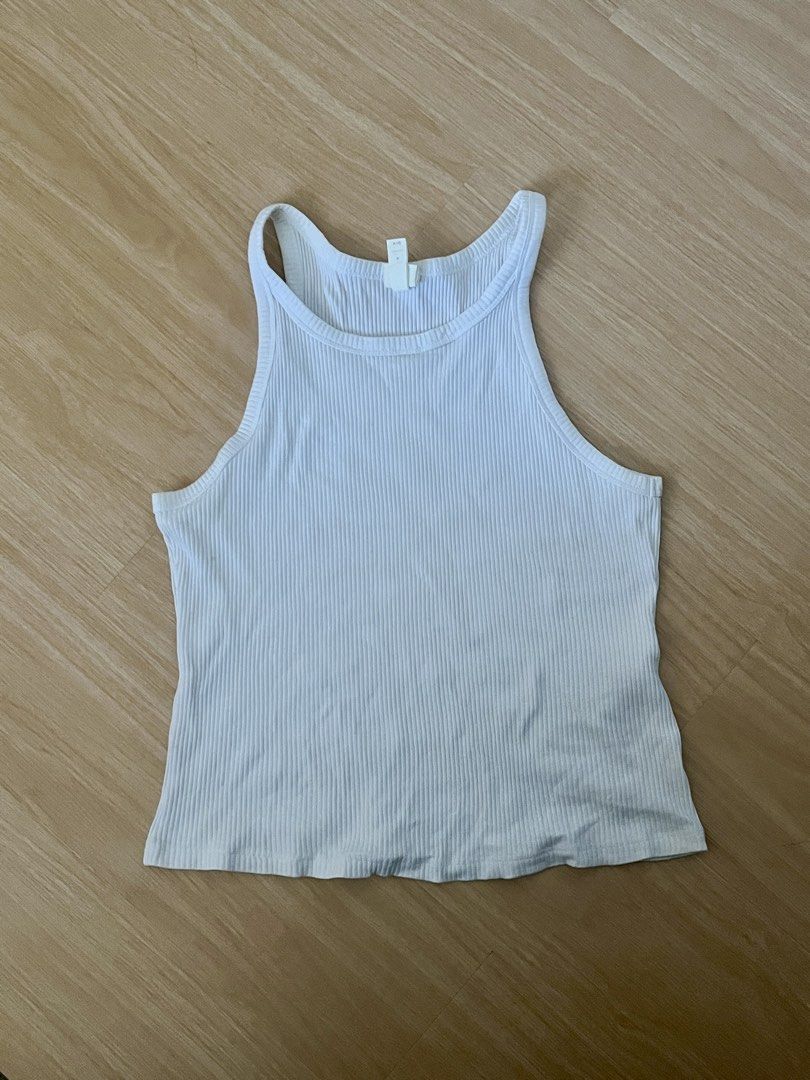 Original H&M Ribbed Tank Top - Size M (Category: Sleeveless) located in Cavite. Submitted by myzn_ (Listing ID 1439869879, Image 1). Description: - H&M white ribbed tank top - Size: M - Material: Cotton and elastane blend - Color: White - Condition: Good, used once.