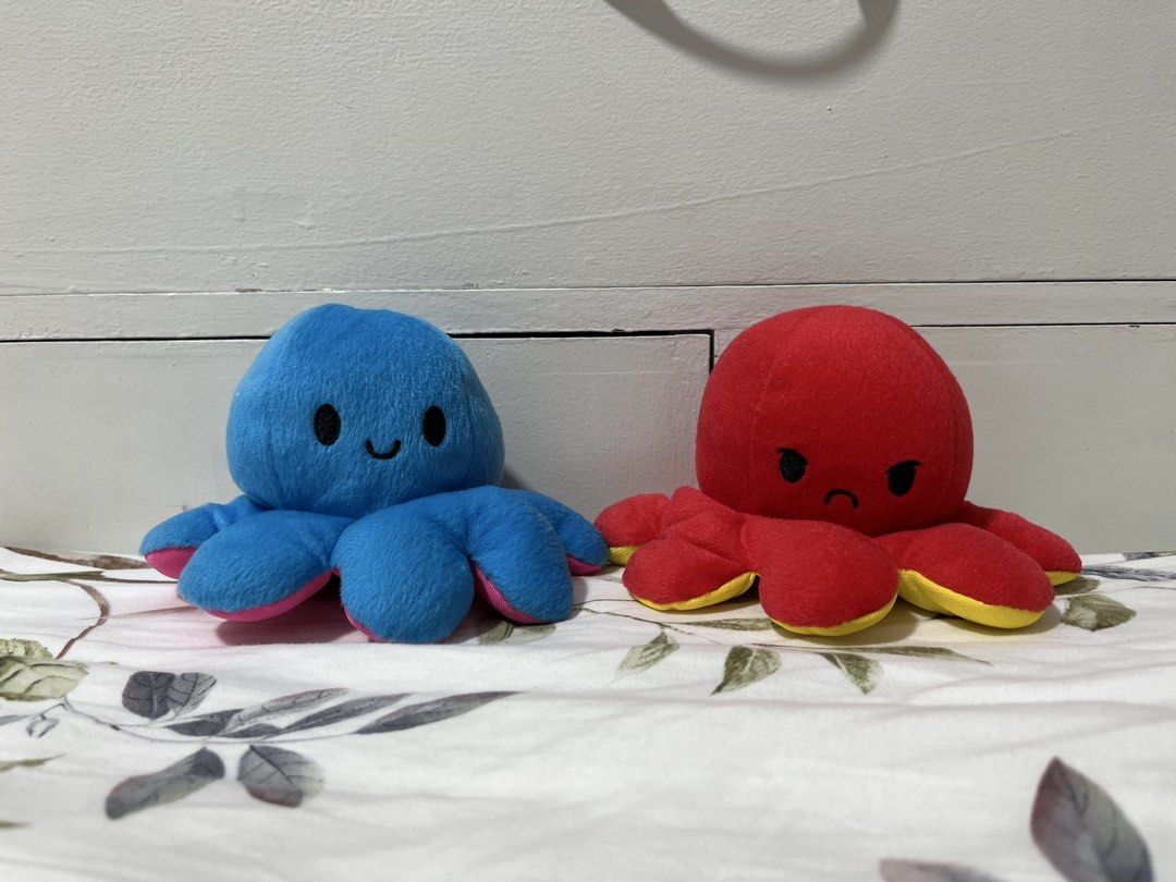 Pair Octopus (Category: Toys & Games) located in Mandaluyong City. Submitted by snowtreasureplushies (Listing ID 1439956677, Image 1). Description: This is a Duo set and can't be bought per piece. Original price was ₱300. But there's a tear on red octopus but blue octopus in good condition..