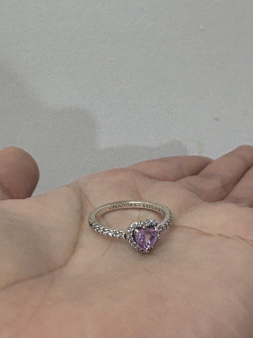 Pandora Sterling Silver Heart Ring with Purple Stone (Category: Rings) located in Manila. Submitted by closetsofaddie (Listing ID 1439928577, Image 3). Description: - Elegant Pandora ring - Features a sparkling heart-shaped purple stone - Band adorned with small clear stones - Crafted from sterling silver - Ideal for gifting or personal collection used only: twice - rfs: need funds ASAP.