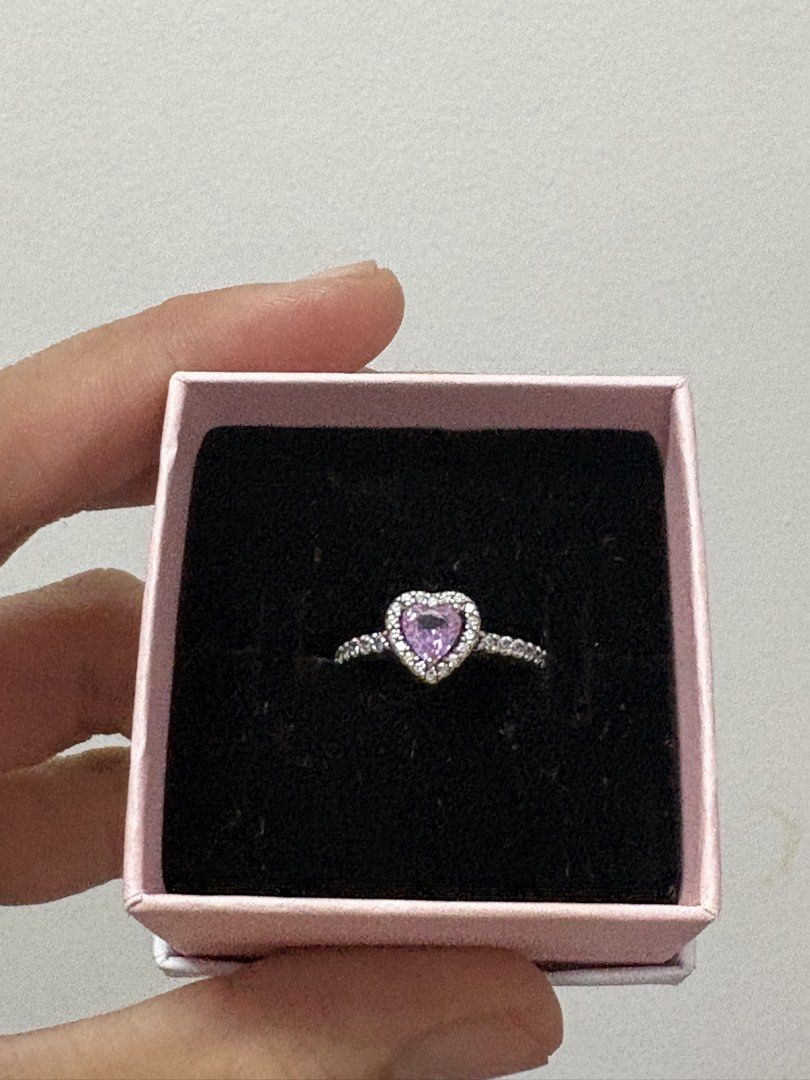 Pandora Sterling Silver Heart Ring with Purple Stone (Category: Rings) located in Manila. Submitted by closetsofaddie (Listing ID 1439928577, Image 2). Description: - Elegant Pandora ring - Features a sparkling heart-shaped purple stone - Band adorned with small clear stones - Crafted from sterling silver - Ideal for gifting or personal collection used only: twice - rfs: need funds ASAP.