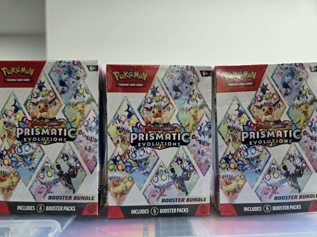 Prismatic Evolution booster bundle (Category: Card Boxes & Cases) located in Singapore. Submitted by alansng84 (Listing ID 1439947154, Image 1). Description: Prismatic Evolution booster bundle! Good for chasing cards or keep as collectible! consist of 6 booster pack!.