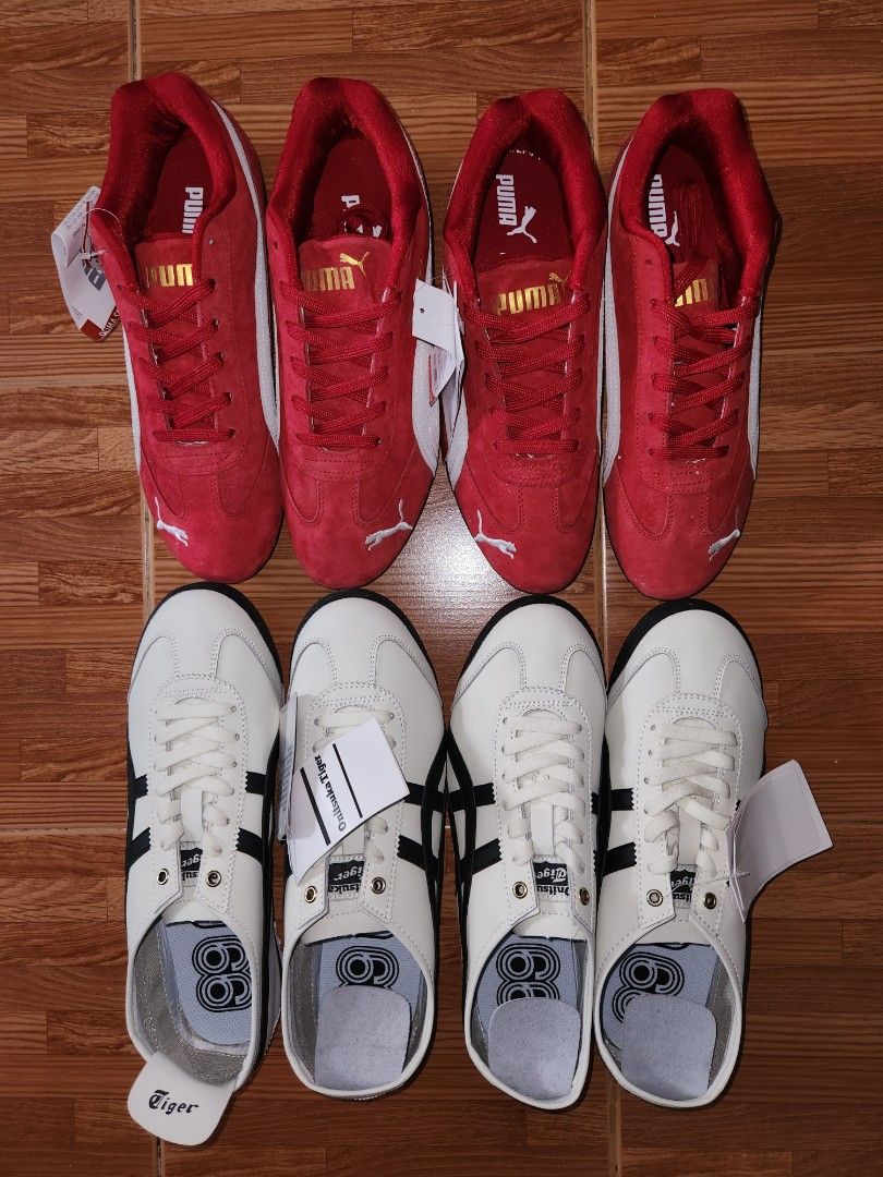 Puma & Onitsuka Tiger Sneakers - Red & White (Category: Casual Shoes) located in Legazpi City. Submitted by davidbpena35728 (Listing ID 1439991340, Image 1). Description: top grade shoes both have us sizes 9 and 10 Pair of red Puma sneakers and a pair of white Onitsuka Tiger sneakers. Both pairs feature classic designs with the respective brand logos. The Puma shoes have a suede-like texture and white accents. The Onitsuka Tiger shoes are low-top