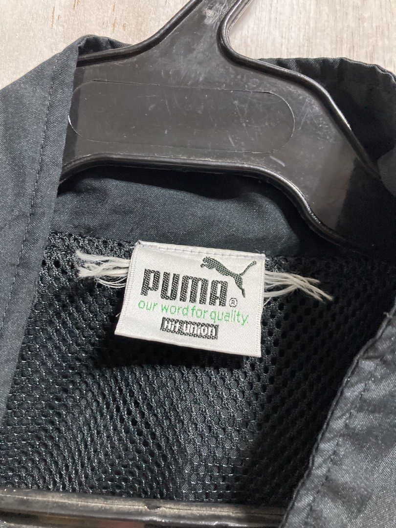 Puma Black Track Jacket with Red Accents (Category: Coats, Jackets and Outerwear) located in Iloilo. Submitted by __kyleeee__ (Listing ID 1439916373, Image 3). Description: - Authentic Puma track jacket - Color: Black with striking red accents - Features: Full zip closure, mesh lining for breathability - Style: Classic Puma design, perfect for casual wear or athletic activities.