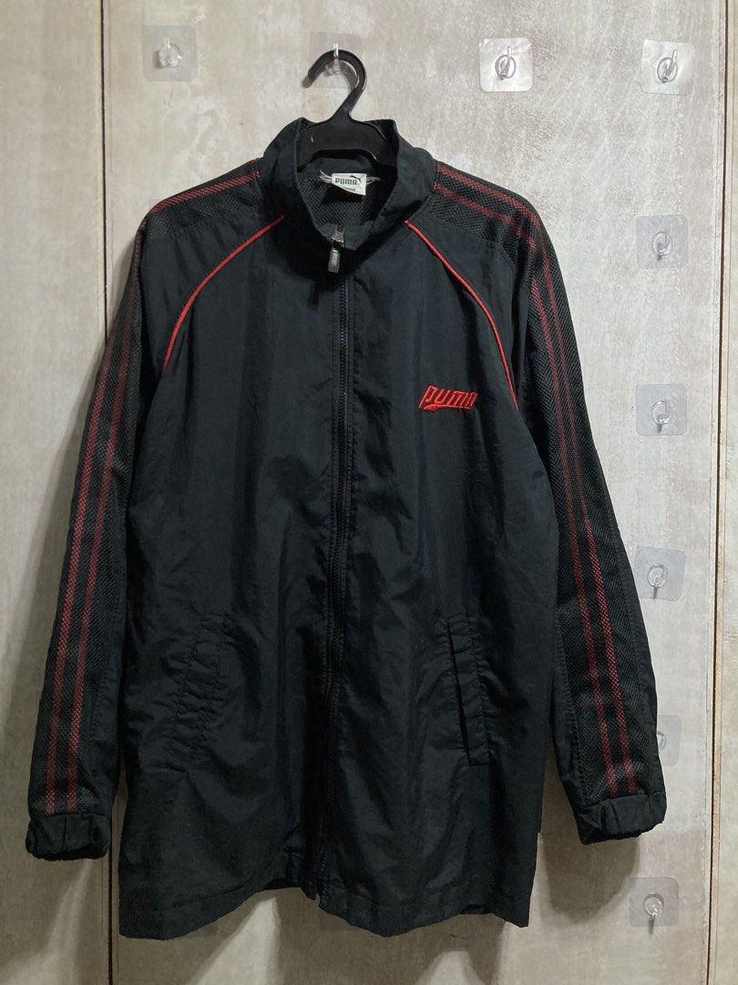 Puma Black Track Jacket with Red Accents (Category: Coats, Jackets and Outerwear) located in Iloilo. Submitted by __kyleeee__ (Listing ID 1439916373, Image 1). Description: - Authentic Puma track jacket - Color: Black with striking red accents - Features: Full zip closure, mesh lining for breathability - Style: Classic Puma design, perfect for casual wear or athletic activities.
