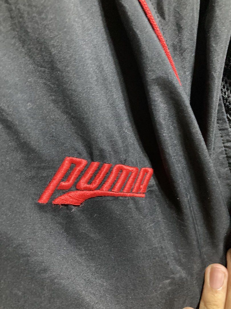 Puma Black Track Jacket with Red Accents (Category: Coats, Jackets and Outerwear) located in Iloilo. Submitted by __kyleeee__ (Listing ID 1439916373, Image 2). Description: - Authentic Puma track jacket - Color: Black with striking red accents - Features: Full zip closure, mesh lining for breathability - Style: Classic Puma design, perfect for casual wear or athletic activities.