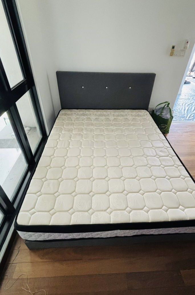Queen Size Bed Frame with Mattress (Category: Bed Frames & Mattresses) located in Kuala Lumpur. Submitted by camyjii (Listing ID 1439828740, Image 2). Description: Puchong area - Queen size bed frame and mattress set. - Bed frame upholstered in stylish grey fabric. - Matching headboard with button design. - Mattress features a comfortable quilted top. - Mattress with elegant black trim..