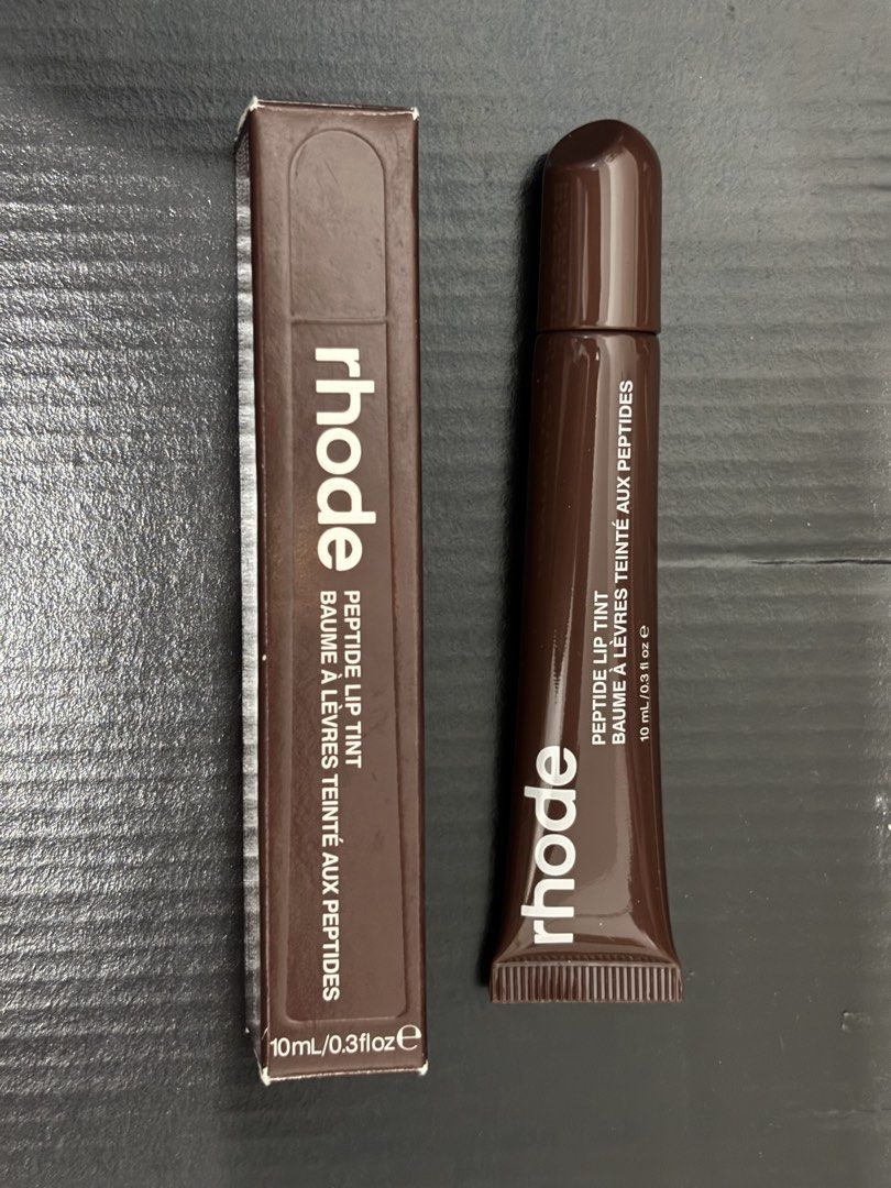 Rhode Peptide Lip Tint in Espresso (Category: Makeup) located in Manila. Submitted by furfural (Listing ID 1439951862, Image 1). Description: - Rhode Peptide Lip Tint - Nourishing lip balm with a hint of color - Hydrates and enhances lips - Convenient for on-the-go application - 10ml (0.3 fl oz) per tube.