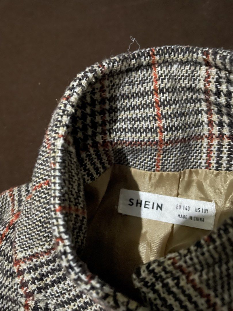 SHEIN Plaid Button-Up Coat (Category: Coats, Jackets and Outerwear) located in Plaridel. Submitted by julien_stuff (Listing ID 1439933165, Image 2). Description: - Stylish plaid design from SHEIN (EXTRA SMALL TO SMALL only) - Ideal for cooler weather - Features a classic collar - Easy button-up front - Two convenient side pockets - Smooth and comfortable inner lining - Smart and warm option for children's everyday wear.